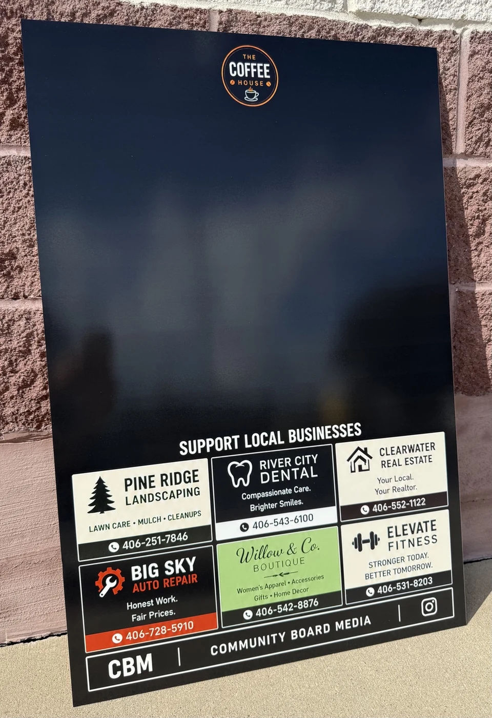 Community Board Media demo board showing a host business logo, writing space, and local advertiser section